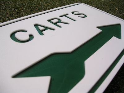 routed white green white cart directional sign