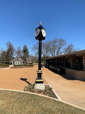 4 sided black and gold clock
