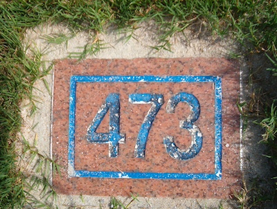 carved brick yardage marker