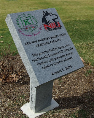 carved grey granite plaque