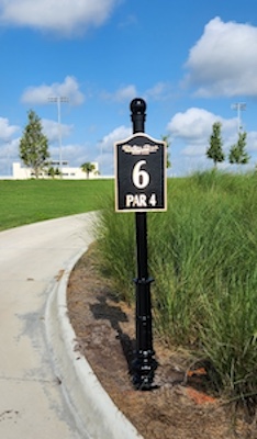 cast bronze tee sign