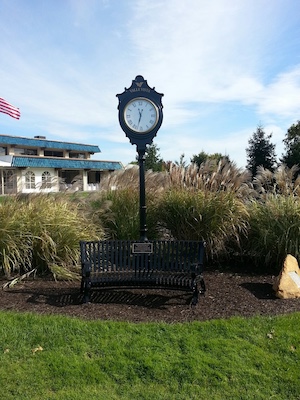 golf clock with metal bench incorporated into base